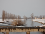 Campagne innevate e canale Muzza